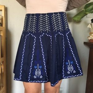 NWOT Blue pleated mini skirt, embroidered design